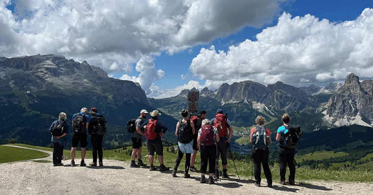 Hikers looking at view of the Dolomite mountains