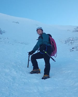 Georgie in the snow with climbing gear