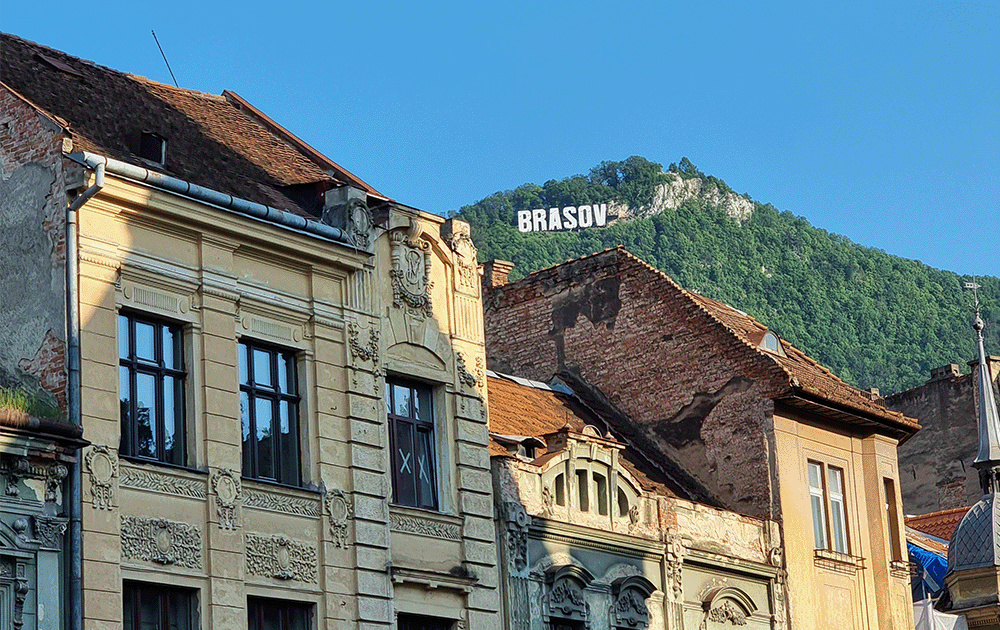 A view of the Braşov city sign on a hill
